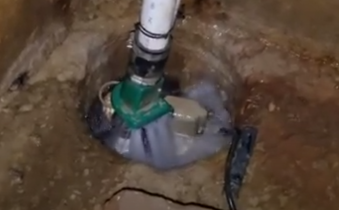 sump pump spraying water
